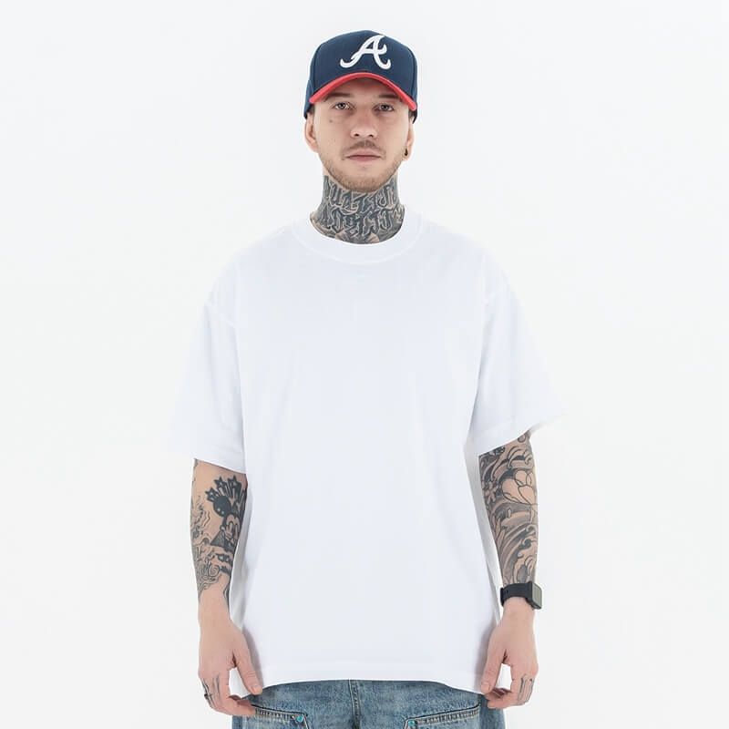 Model wearing a 100% Cotton Customizable Graphic Multi-Color Solid T-Shirt in front view