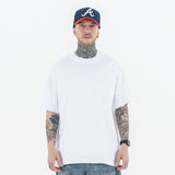 Model wearing a 100% Cotton Customizable Graphic Multi-Color Solid T-Shirt in front view