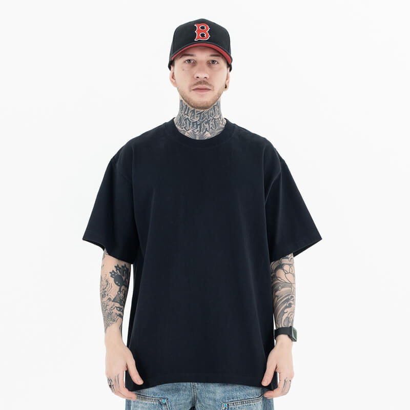 Model wearing a 100% Cotton Customizable Graphic Multi-Color Solid T-Shirt in front view