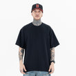 Model wearing a 100% Cotton Customizable Graphic Multi-Color Solid T-Shirt in front view