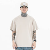 Model wearing a 100% Cotton Customizable Graphic Multi-Color Solid T-Shirt in front view