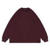 Flat lay of maple red classic crew neck solid color custom long sleeve t-shirt.