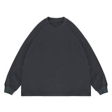 Flat lay of dark gray classic crew neck solid color custom long sleeve t-shirt.