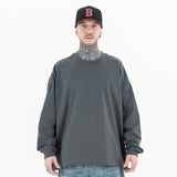 Model wearing front view of classic crew neck solid color custom long sleeve t-shirt.