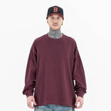Model wearing front view of classic crew neck solid color custom long sleeve t-shirt.