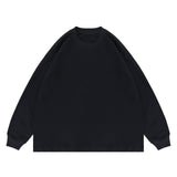 Flat lay of black classic crew neck solid color custom long sleeve t-shirt.