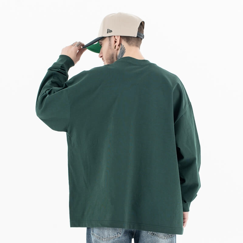 Back view of a model wearing a cotton Jesus graphic long sleeve T-shirt.