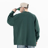 Back view of a model wearing a cotton Jesus graphic long sleeve T-shirt.
