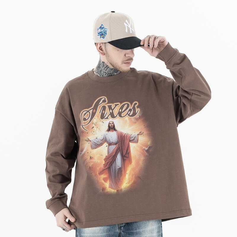 Front view of a model wearing a cotton Jesus graphic long sleeve T-shirt.