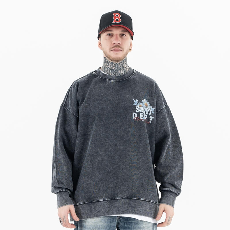 Front view of a model in a vintage floral graphic sweatshirt