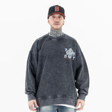 Front view of a model in a vintage floral graphic sweatshirt