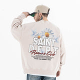 Back view of a model in a vintage floral graphic sweatshirt