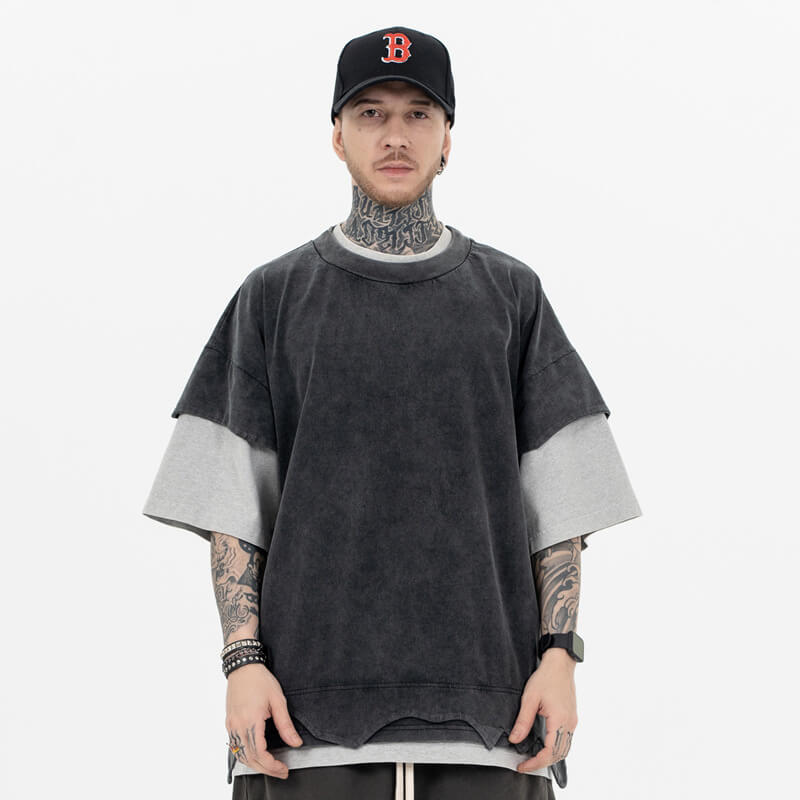 Front view of a model wearing a double collar solid color T-shirt.