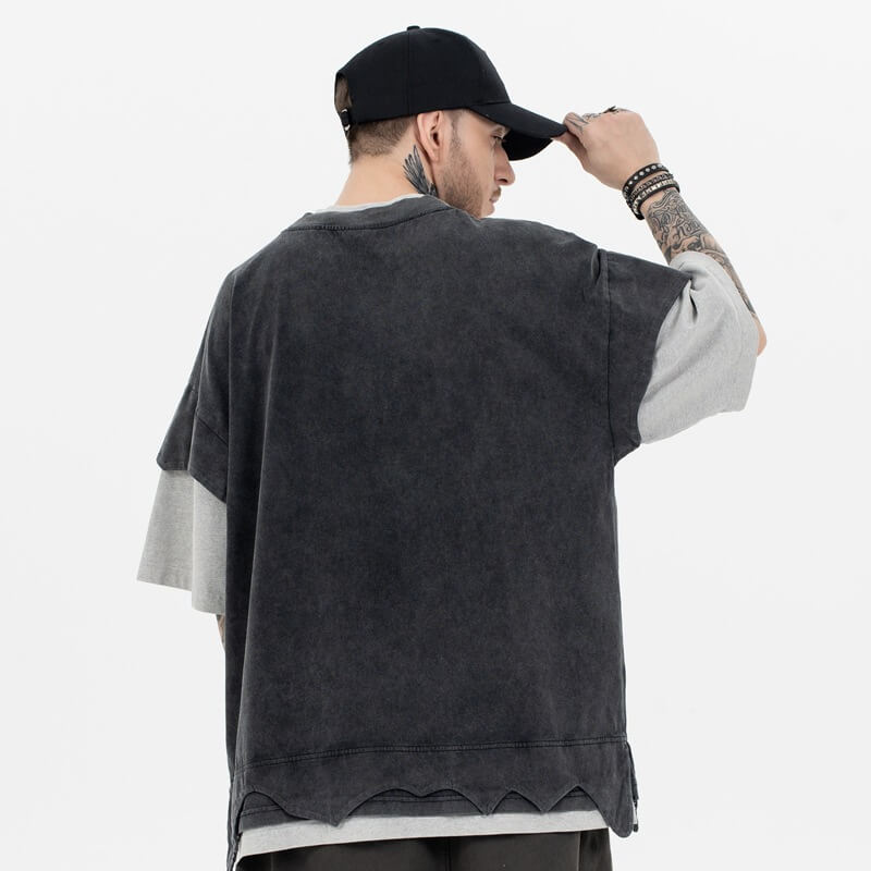 Back view of a model wearing a double collar solid color T-shirt.