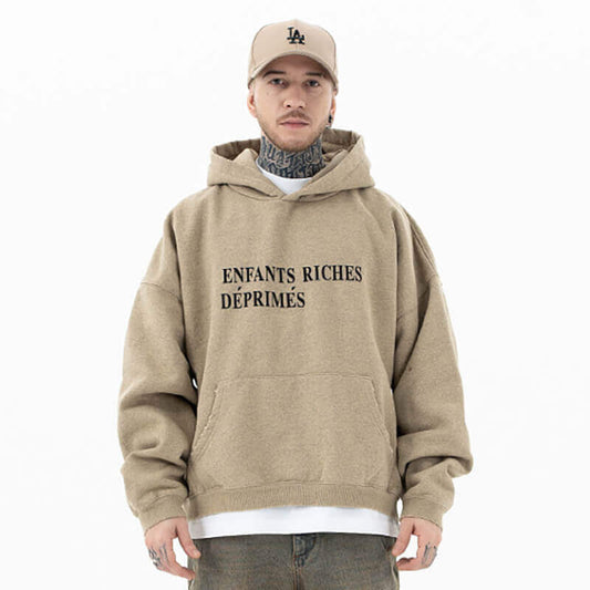 Model wearing enfants riches deprimes classic logo vintage graphic hoodie front view.