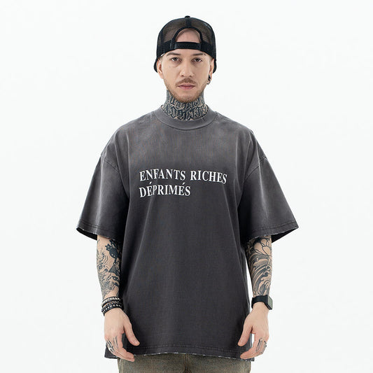 Model wearing front view of enfants riches deprimes vintage washed classic logo graphic t-shirt.