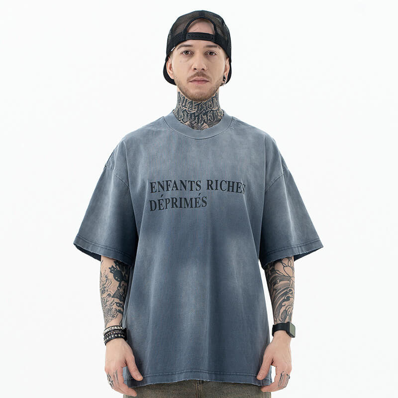 Model wearing front view of enfants riches deprimes vintage washed classic logo graphic t-shirt.