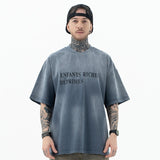 Model wearing front view of enfants riches deprimes vintage washed classic logo graphic t-shirt.