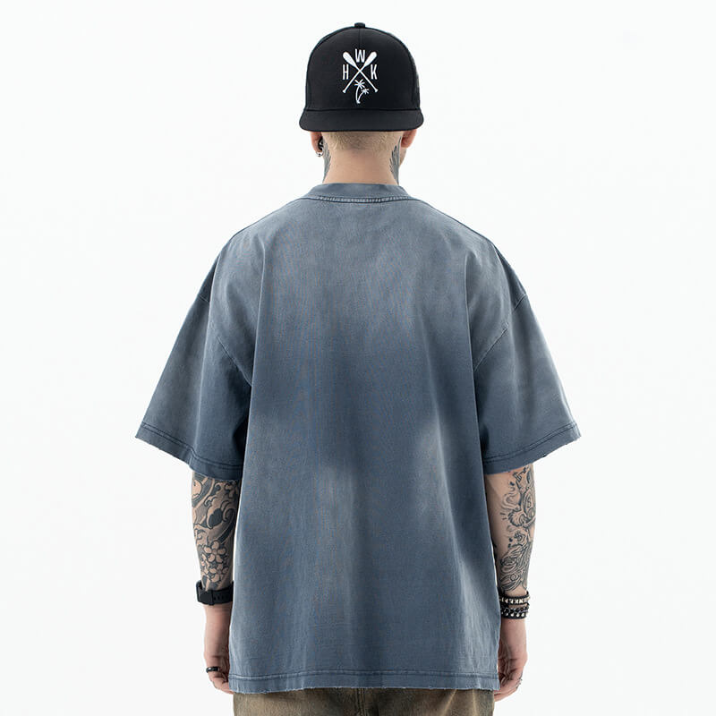 Model wearing back view of enfants riches deprimes vintage washed classic logo graphic t-shirt.