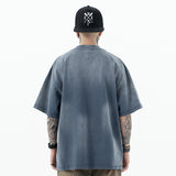 Model wearing back view of enfants riches deprimes vintage washed classic logo graphic t-shirt.