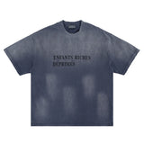 Flat lay of blue enfants riches deprimes vintage washed classic logo graphic t-shirt.