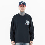 Front view of a model wearing a washed floral long sleeve graphic T-shirt