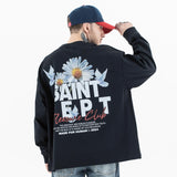 Back view of a model wearing a washed floral long sleeve graphic T-shirt