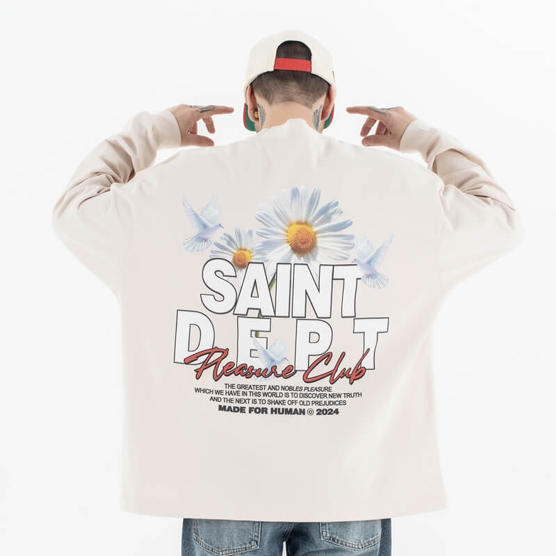 Back view of a model wearing a washed floral long sleeve graphic T-shirt