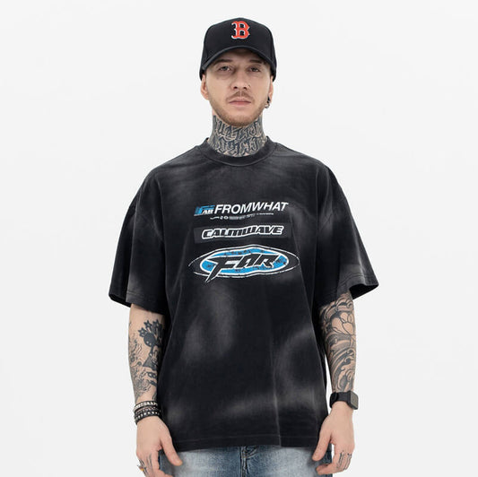 Model wearing front view of From What vintage washed black t-shirt.