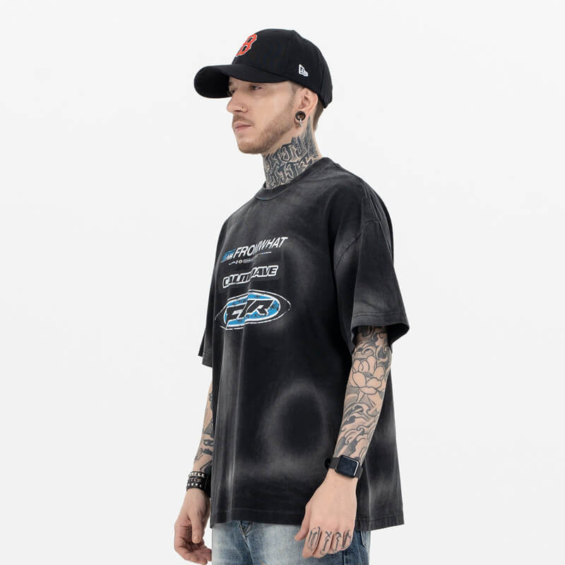 Model wearing side view of From What vintage washed black t-shirt.