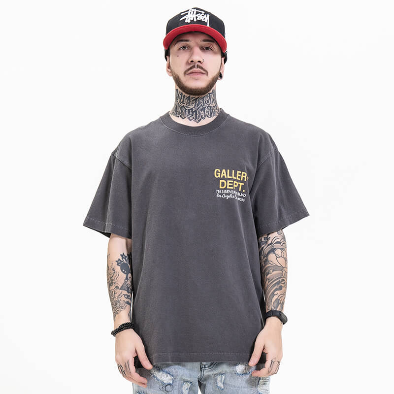 Model wearing front view of gallery dept gray car graphic t-shirt.