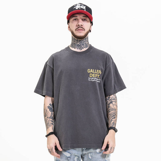 Model wearing front view of gallery dept gray car graphic t-shirt.