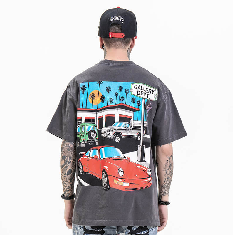 Model wearing back view of gallery dept gray car graphic t-shirt.