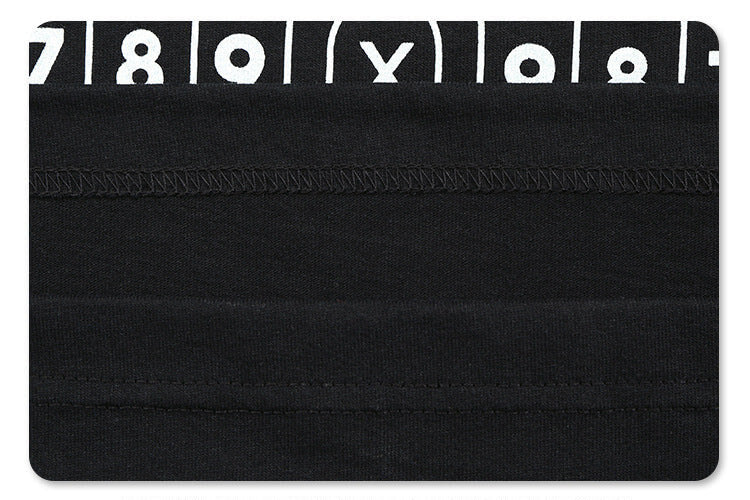 Close-up of fabric detail on hip-hop style shooting graphic t-shirt