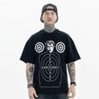 Model wearing black hip-hop style shooting graphic t-shirt front view