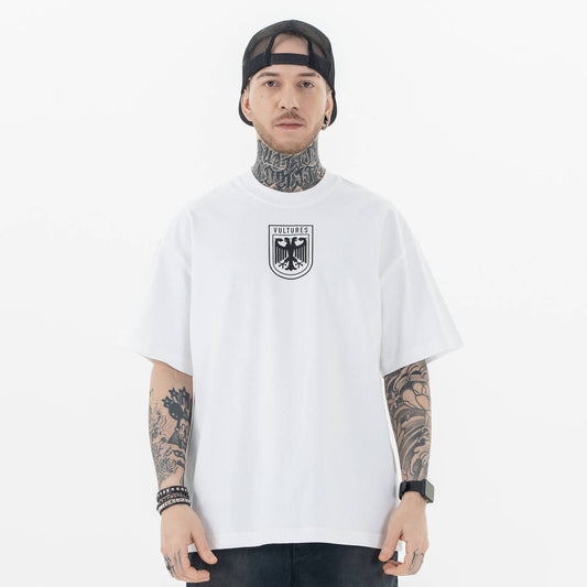 Model wearing front view of kanye west vultures graphic t-shirt.