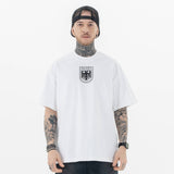 Model wearing front view of kanye west vultures graphic t-shirt.