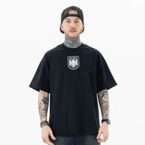 Model wearing front view of kanye west vultures graphic t-shirt.
