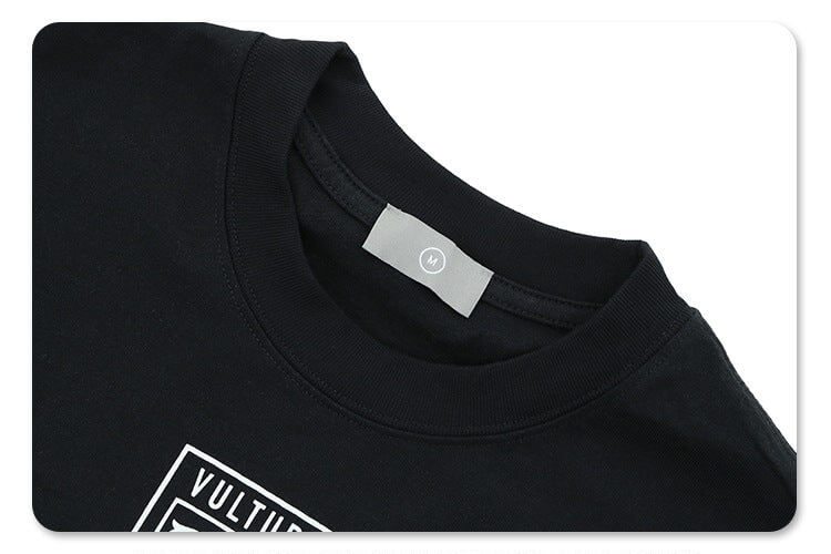 Collar detail of kanye west vultures graphic t-shirt.