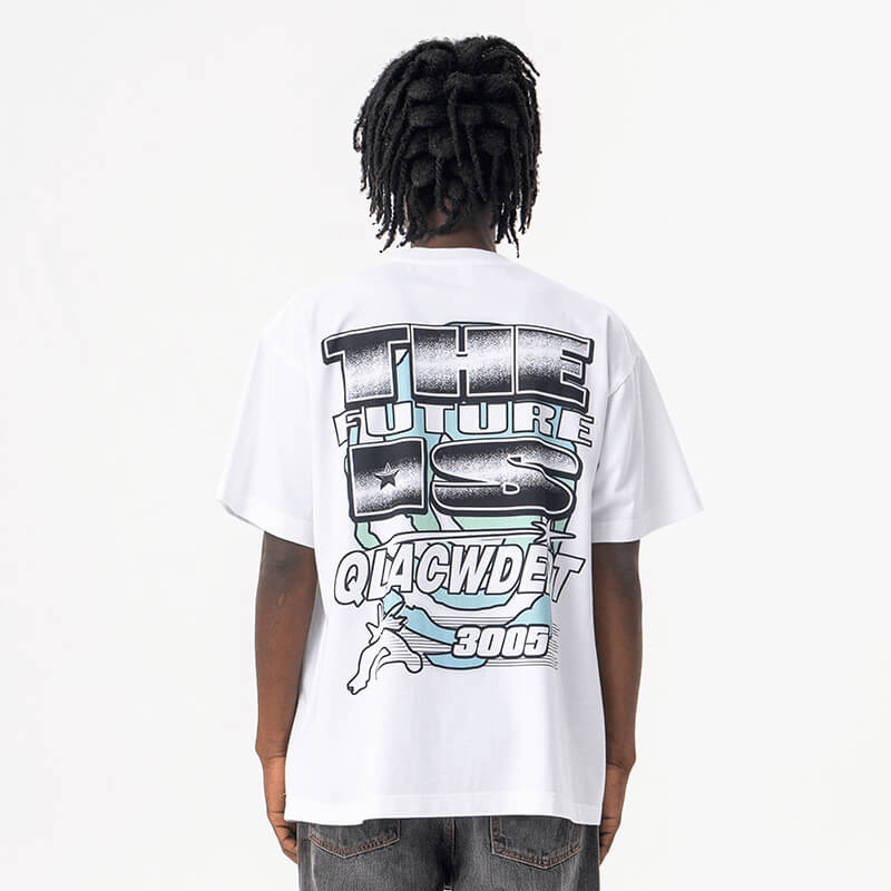 Model wearing back view of white qlacw brand street fashion graphic t shirt.
