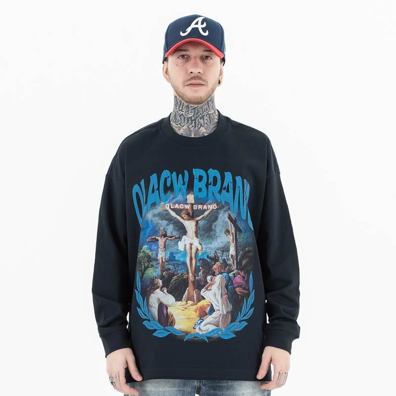 Front view of a model wearing a QLACW logo soft pure cotton long sleeve T-shirt