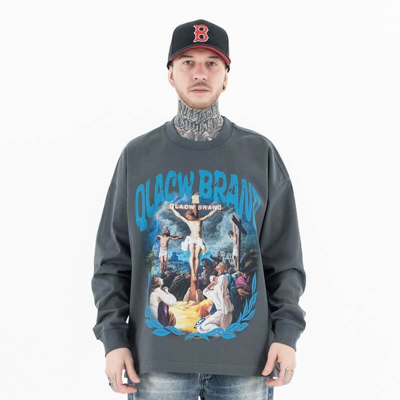 Front view of a model wearing a QLACW logo soft pure cotton long sleeve T-shirt