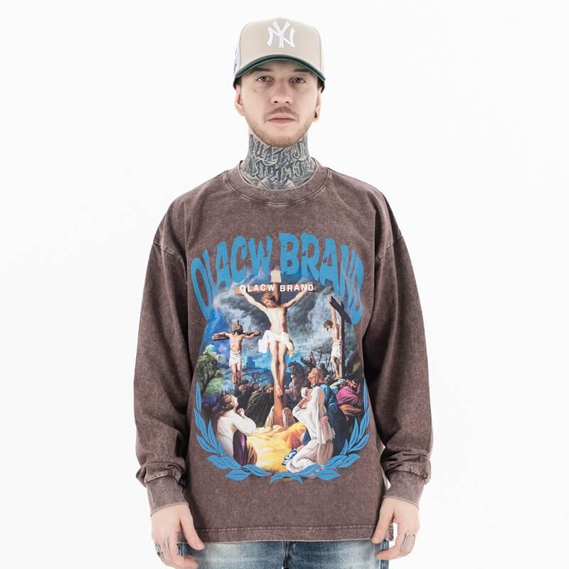 Qlacw crewneck long sleeve t-shirt with jesus cross, model front view.