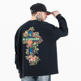 Back view of a model wearing a QLACW logo street cross long sleeve T-shirt