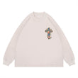 Flat lay of a QLACW logo street cross long sleeve graphic T-shirt