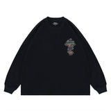 Flat lay of a QLACW logo street cross long sleeve graphic T-shirt