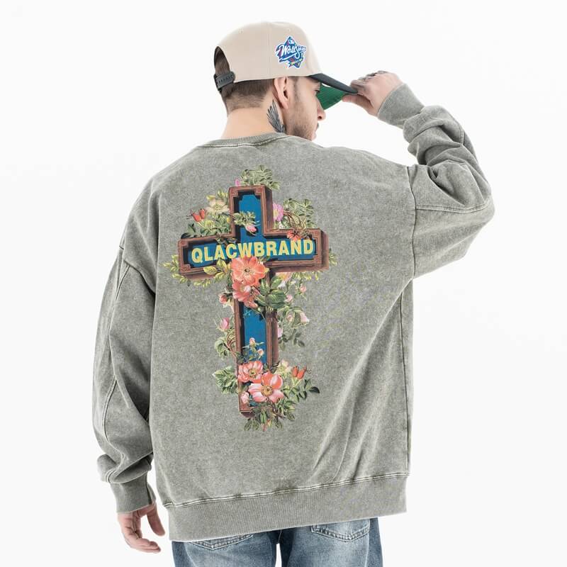 Back view of a model wearing a 'QLACW' vintage street graphic sweatshirt