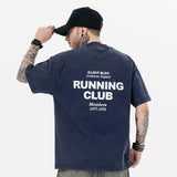 Model wearing back view of running club vintage graphic t-shirt.