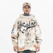 Model wearing front view of saint fleece street graffiti graphic hoodie.