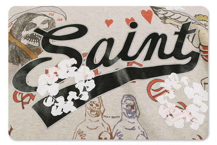 Close-up of graphic design on saint fleece street graffiti graphic hoodie.
